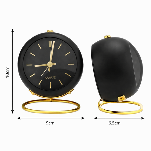 svart retro väckarklocka med gulddetaljer