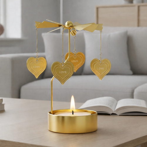 änglaspel i guld på soffbord vardagsrum