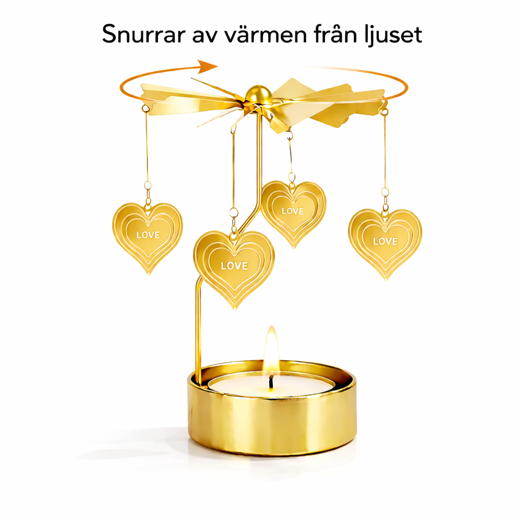 roterande änglaspel i guld med värmeljus